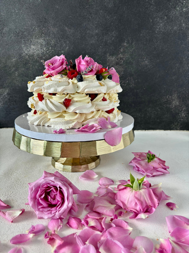 Custom Cakes for Every Occasion. Vanilla Pavlova cake in Honolulu. This vanilla pavlova is made with crispy meringue layers, white chocolate chantilly filling and decorated with fresh roses, lavender and fresh berries.