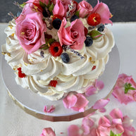Custom Cakes for Every Occasion. Vanilla Pavlova cake in Honolulu. This vanilla pavlova is made with crispy meringue layers, white chocolate chantilly filling and decorated with fresh roses, lavender and fresh berries.