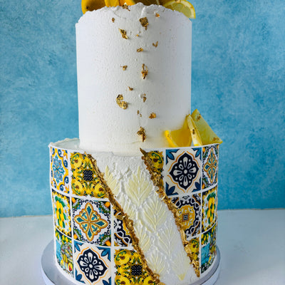 Wedding Cakes Oahu, Elegant Wedding Cakes. This two-tier Italian Amalfi Coast tile wedding cake is made with vanilla sponge, lemon curd filling, fresh lemons, and Swiss vanilla buttercream frosting.